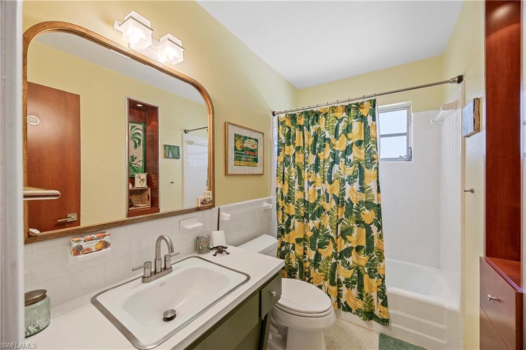 1304 Milano Drive Naples, FL 34103 - Photo 16 of 37 a bathroom with a sink toilet and shower