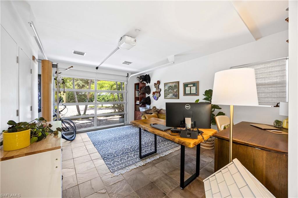 1304 Milano Drive Naples, FL 34103 - Photo 19 of 37 a workspace with furniture and a window