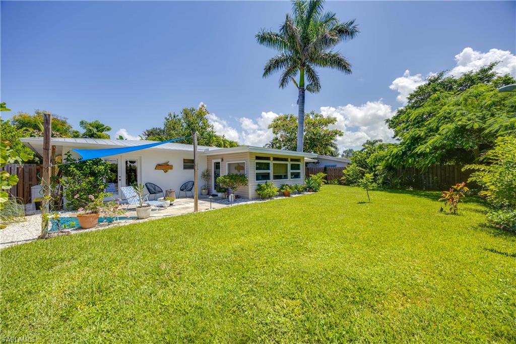 1304 Milano Drive Naples, FL 34103 - Photo 22 of 37 a view of a swimming pool with a patio