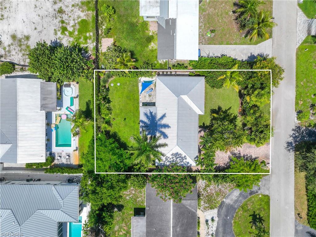 1304 Milano Drive Naples, FL 34103 - Photo 27 of 37 an aerial view of a house with a garden