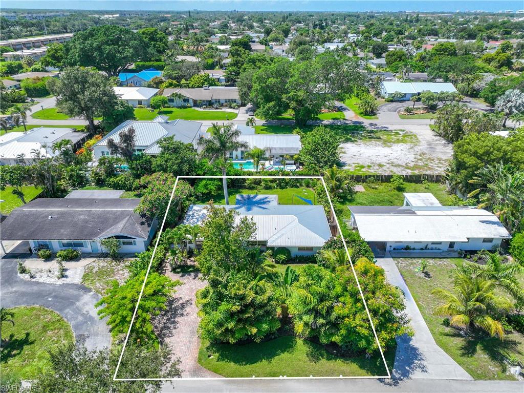 1304 Milano Drive Naples, FL 34103 - Photo 31 of 37 an aerial view of a house with a garden