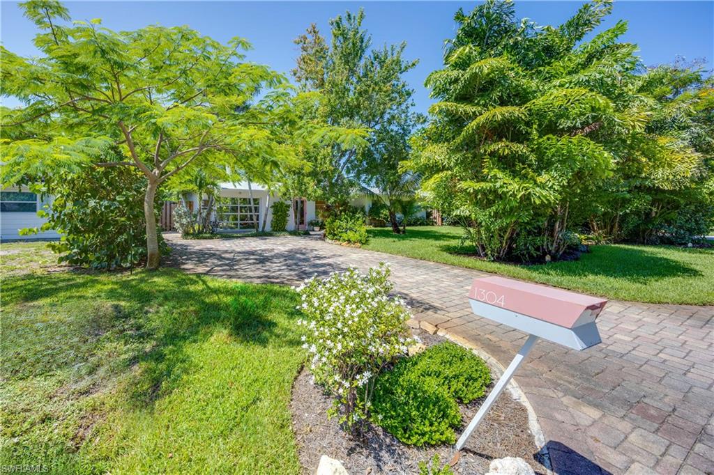 1304 Milano Drive Naples, FL 34103 - Photo 35 of 37 a view of yard with green space
