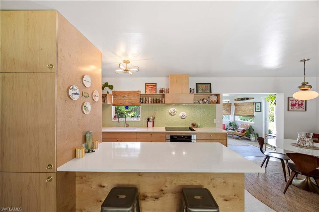 1304 Milano Drive Naples, FL 34103 - Photo 4 of 37 a room with stainless steel appliances furniture and a kitchen view