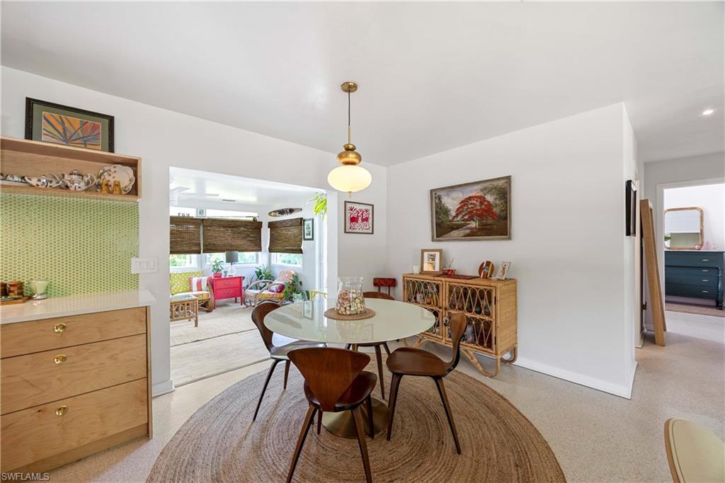 1304 Milano Drive Naples, FL 34103 - Photo 6 of 37 a dining room with furniture and window
