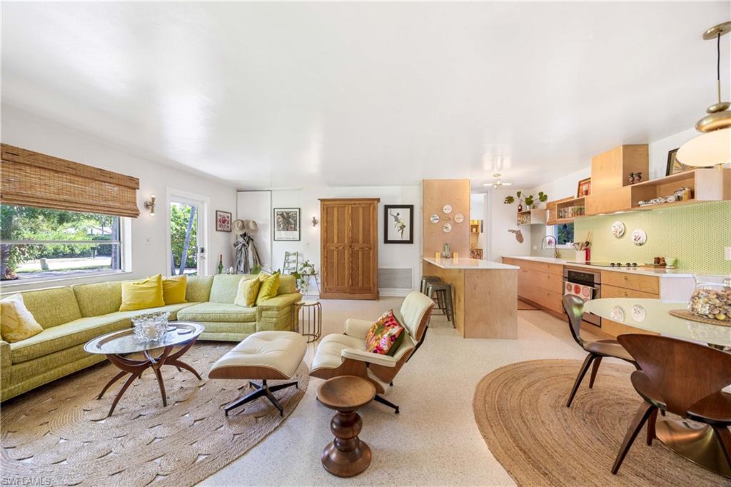 1304 Milano Drive Naples, FL 34103 - Photo 7 of 37 a living room with furniture and a large window