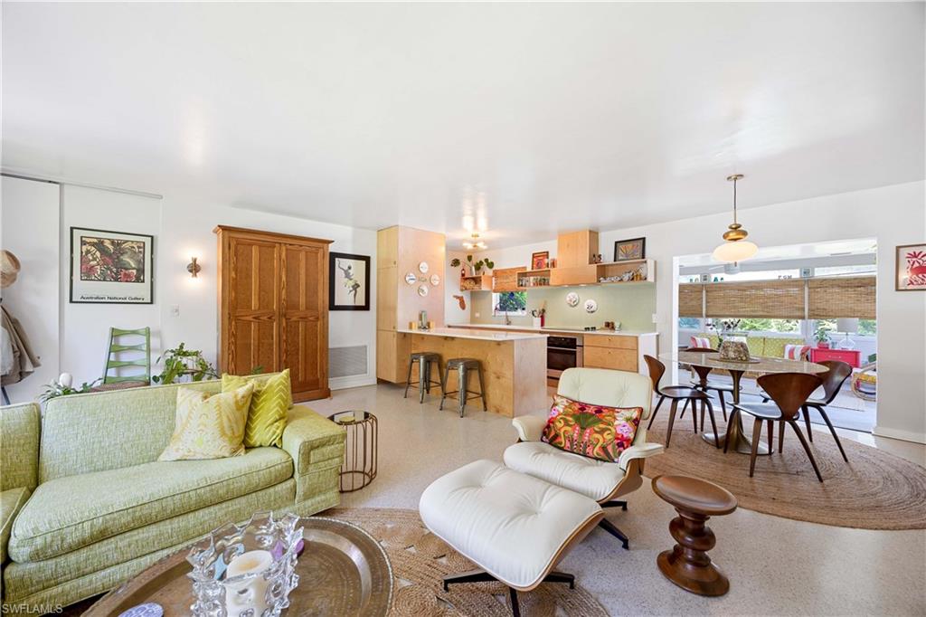 1304 Milano Drive Naples, FL 34103 - Photo 10 of 37 a living room with furniture and a large window