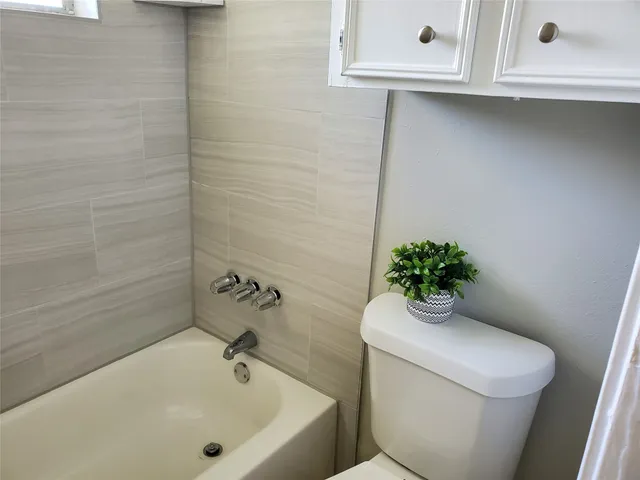 a bathroom with a sink and toilet