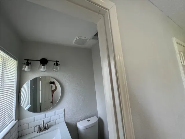 a front view of a house with washer and dryer