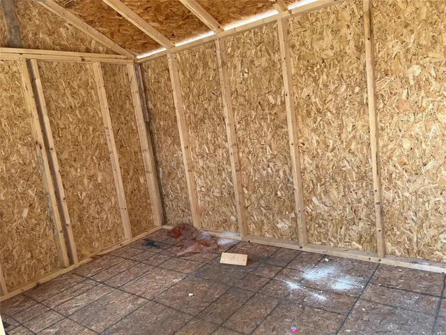 a view of shower and wooden door