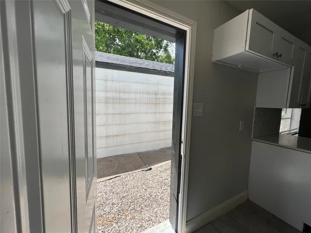 a bathroom with a glass shower door