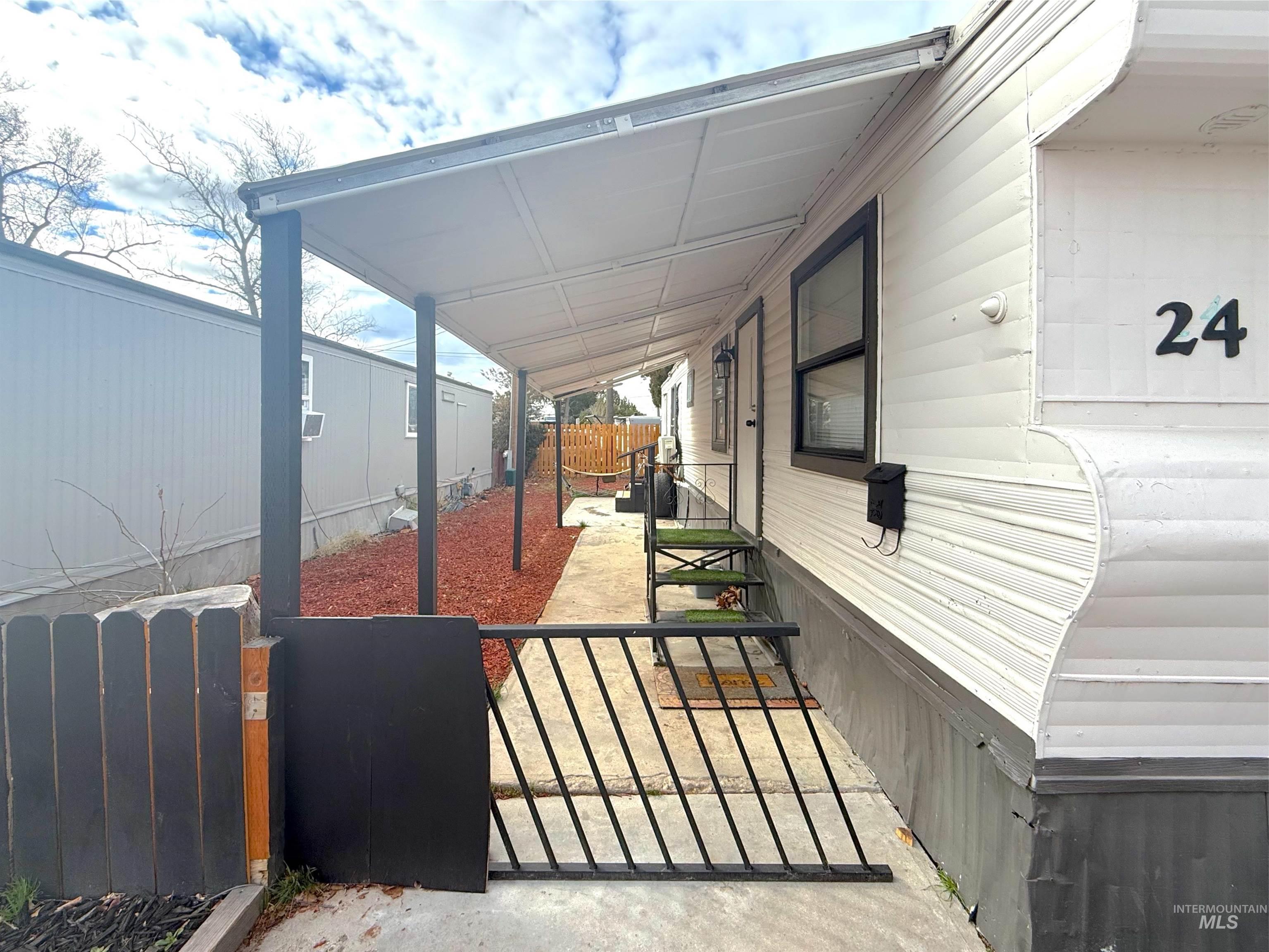 6728 West Fairview Avenue, Unit 24 Boise, ID 83704 - Photo 2 of 9 Porch featuring a gate
