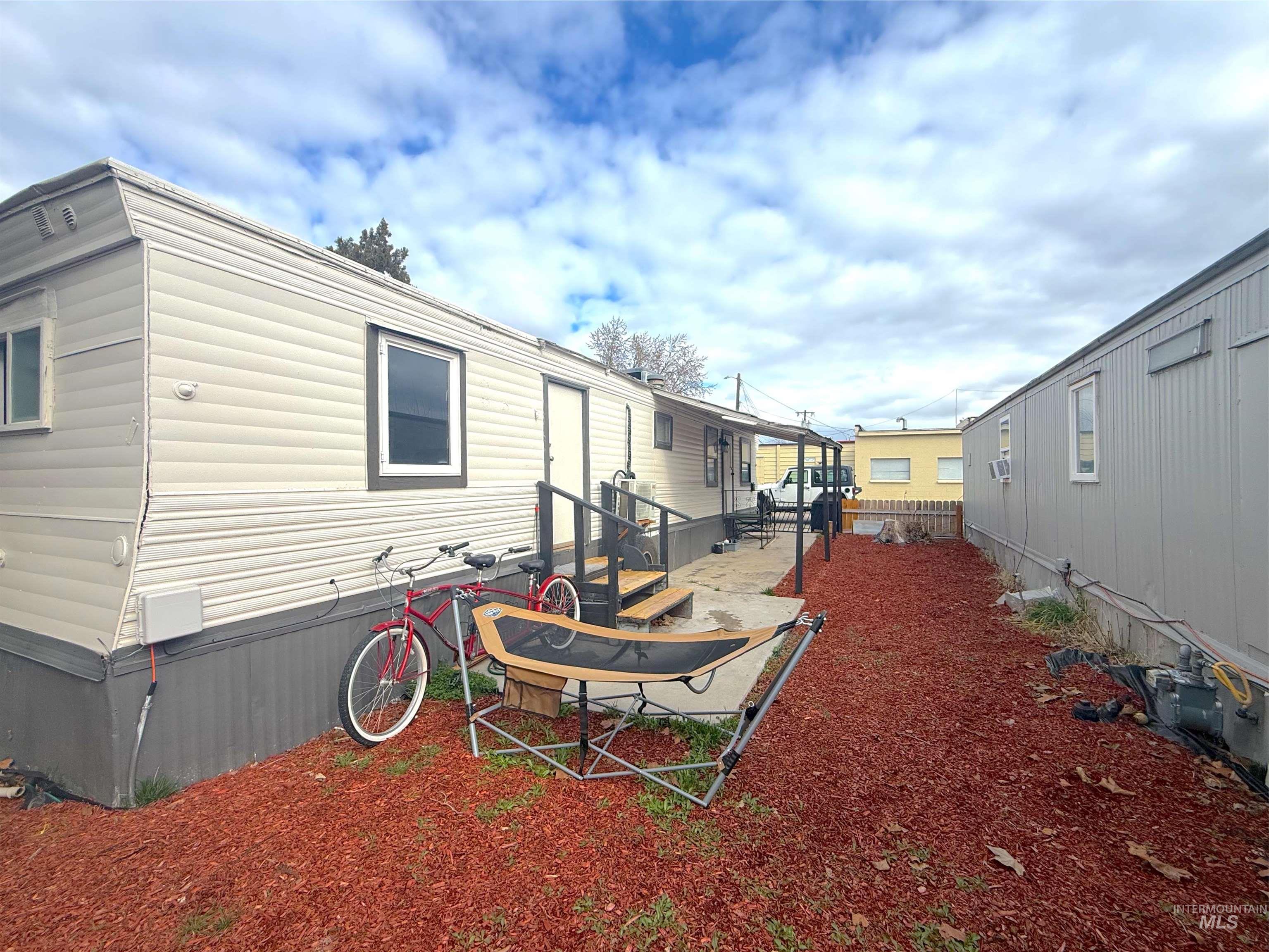 6728 West Fairview Avenue, Unit 24 Boise, ID 83704 - Photo 4 of 9 Rear view of house