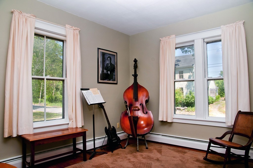 76 Randall Road Berlin, MA 01503 - Photo 13 of 29 a bedroom with filled window and a chair