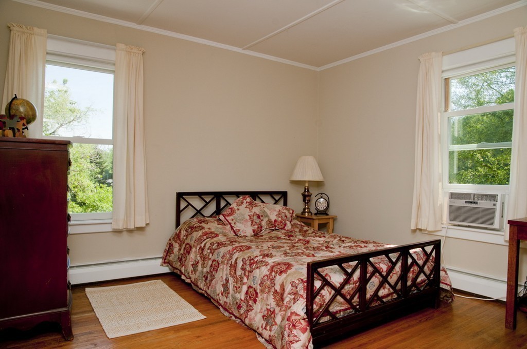 76 Randall Road Berlin, MA 01503 - Photo 21 of 29 a bed sitting in a bedroom next to a window
