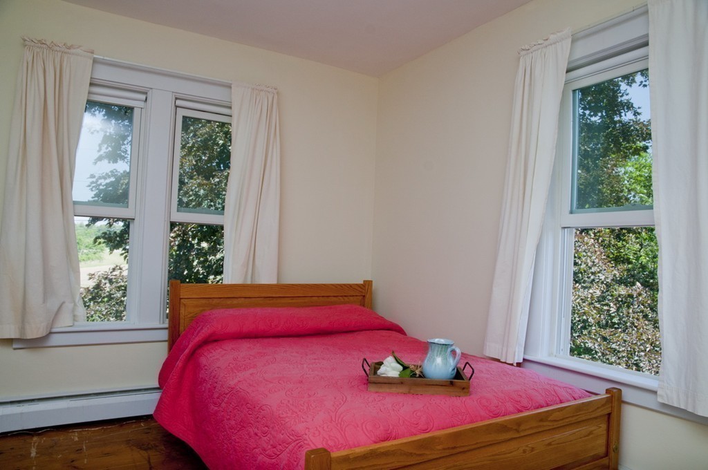 76 Randall Road Berlin, MA 01503 - Photo 22 of 29 a bedroom with a bed and window