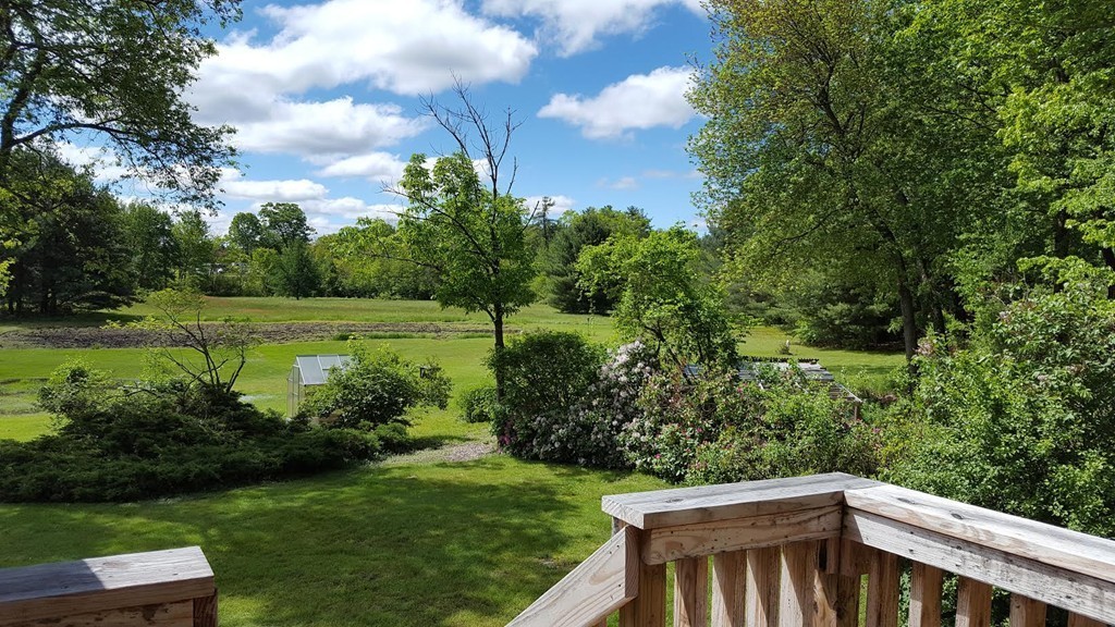76 Randall Road Berlin, MA 01503 - Photo 26 of 29 a view of a yard with furniture and a garden