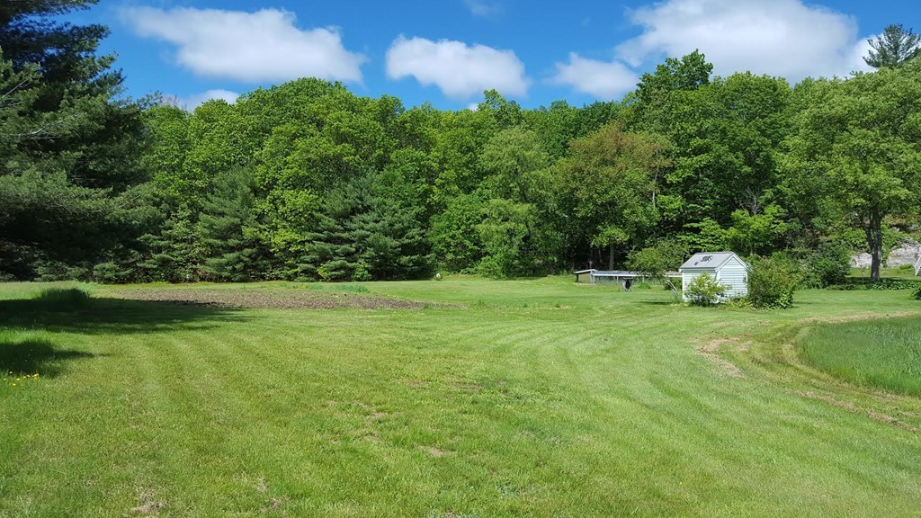 76 Randall Road Berlin, MA 01503 - Photo 6 of 29 a front view of a house with a yard