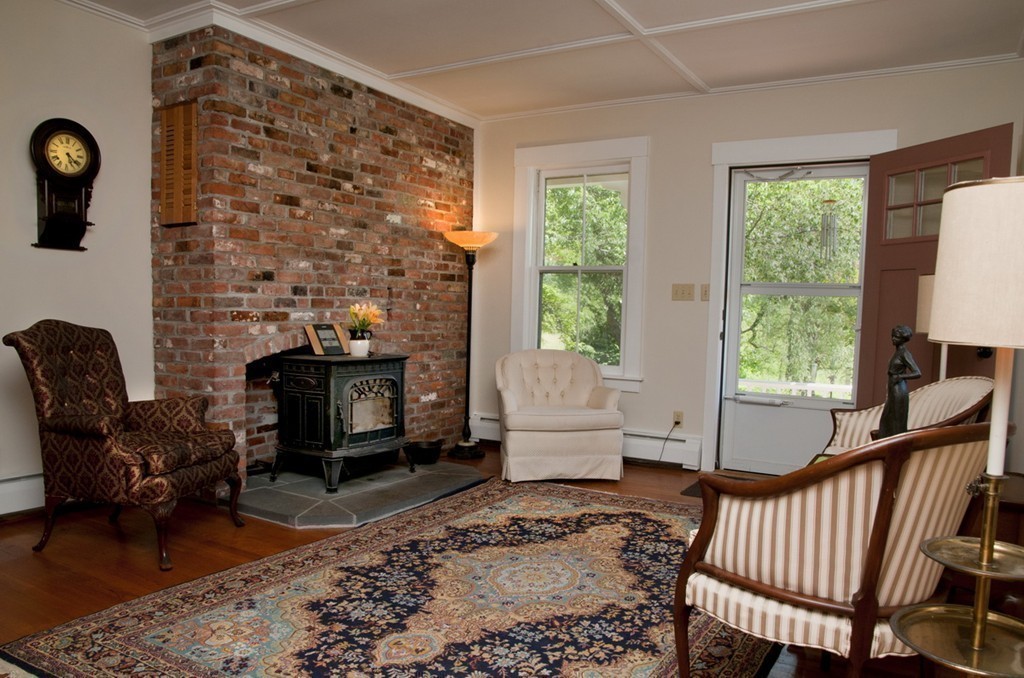 76 Randall Road Berlin, MA 01503 - Photo 7 of 29 a living room with furniture and a fireplace