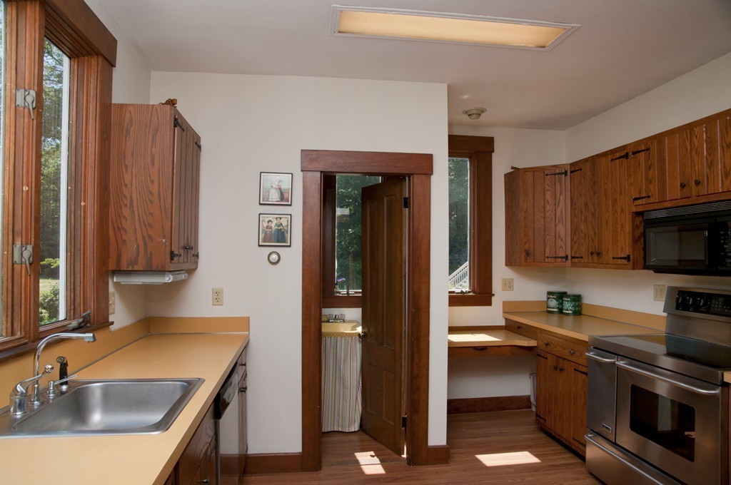 76 Randall Road Berlin, MA 01503 - Photo 10 of 29 a kitchen with a sink stove and cabinets