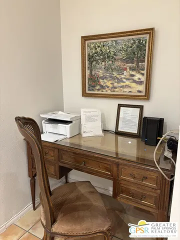 a bedroom with a bed and a lamp