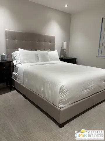 a spacious bathroom with a sink mirror and toilet