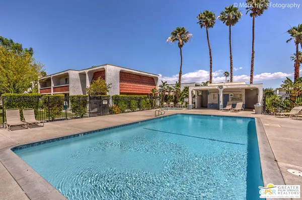 a view of a swimming pool with a patio