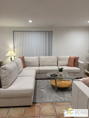 a living room with furniture and a window