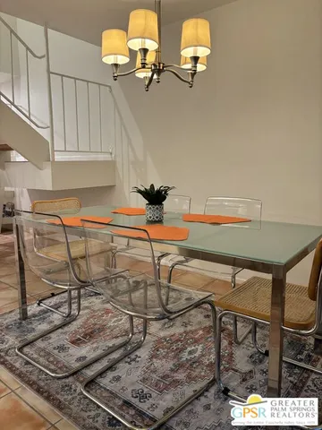 a kitchen with a refrigerator and a sink