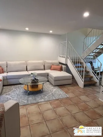 a room with stairs and a table