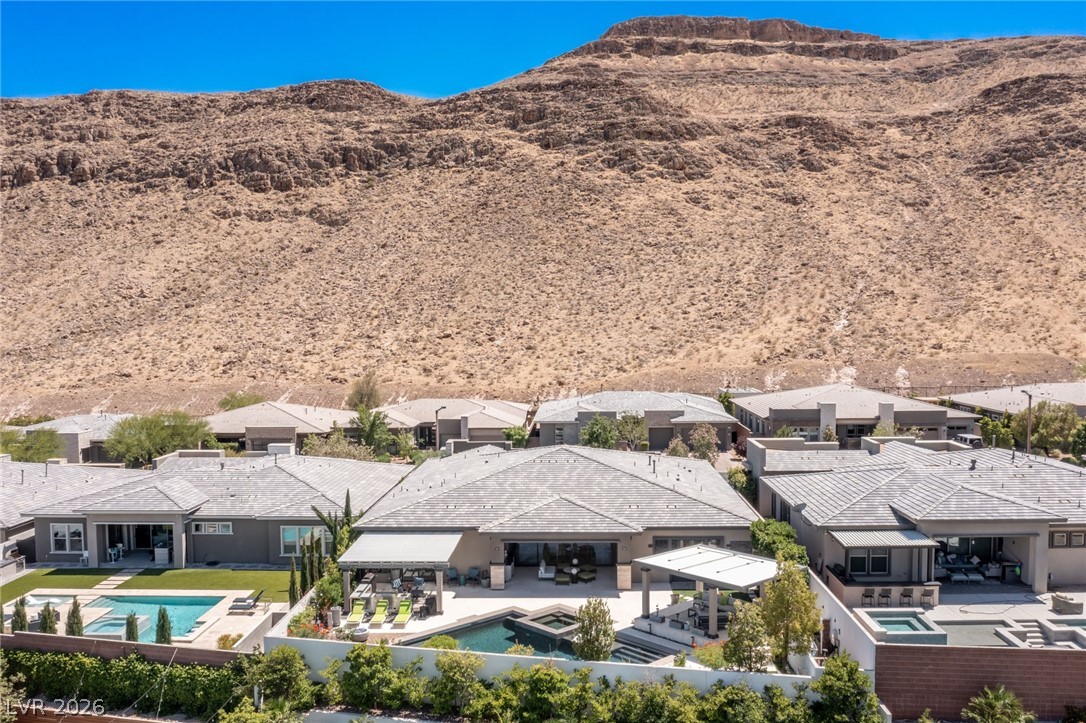 10118 Copper Edge Road Las Vegas, NV 89148 - Photo 46 of 48 An aerial perspective reveals a luxurious desert oasis, complete with private pools and mountain vistas.
