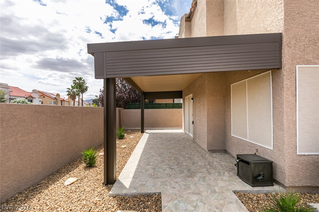 540 Sutters Mill Road Henderson, NV 89014 - Photo 45 of 46 An inviting covered patio offers a private outdoor retreat, perfect for relaxation and fresh air.