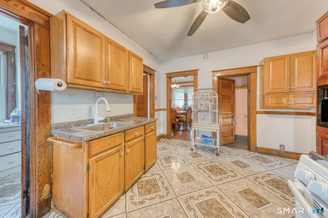 a kitchen with stainless steel appliances granite countertop a stove and a refrigerator