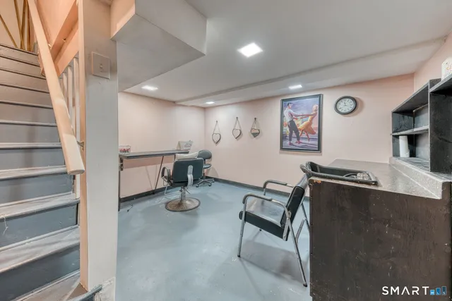 a view of a livingroom with furniture and a flat screen tv