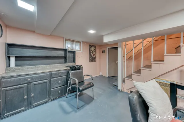 a kitchen with a sink appliances and furniture