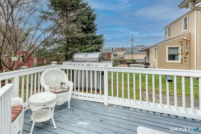 a view of a chair and table in the balcony