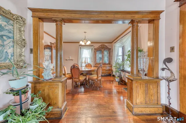 a lobby with furniture and floor to ceiling window