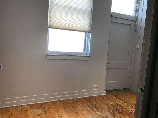 a view of livingroom with hardwood floor and window