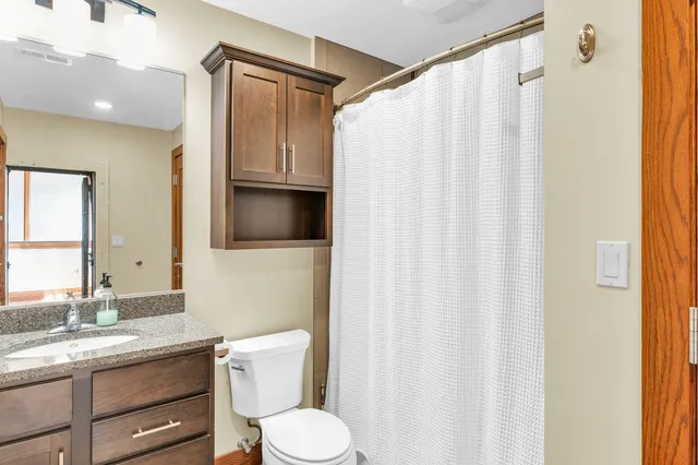a view of a dining room with furniture and a window