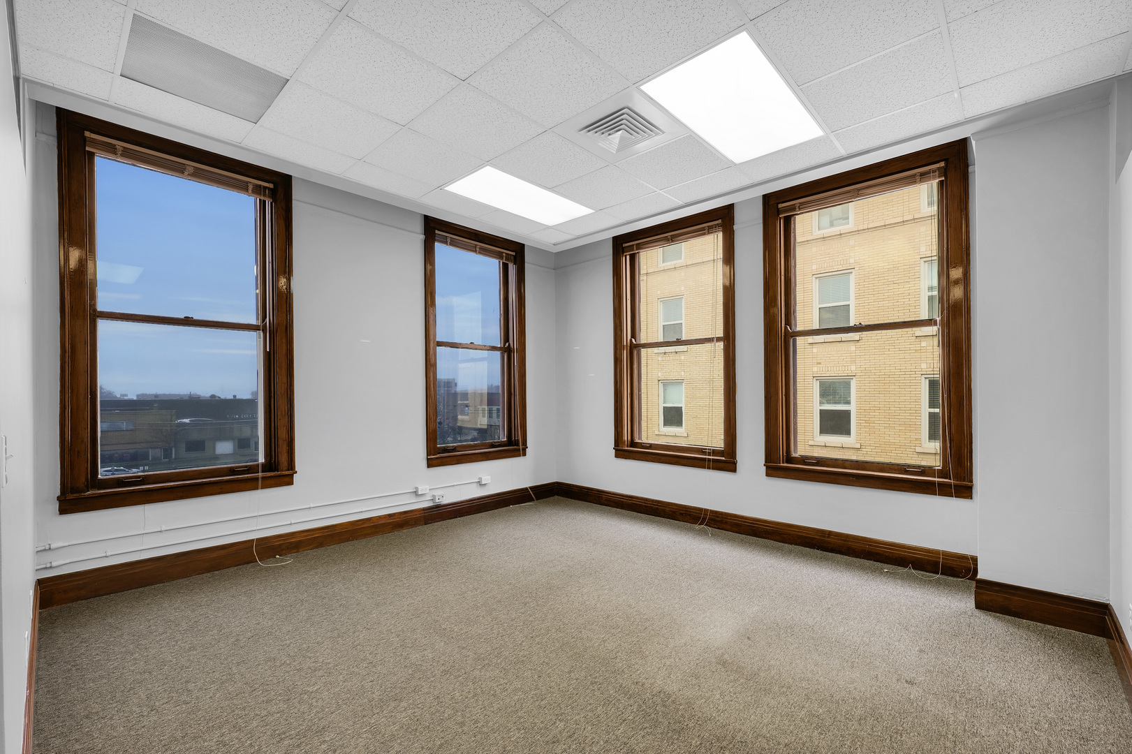 41 East University Avenue Champaign, IL 61820 - Photo 50 of 83 an empty room with windows
