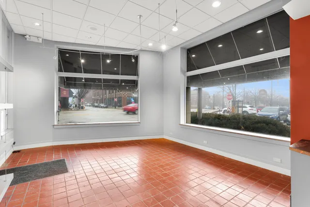 a view of a living room with a wooden floor