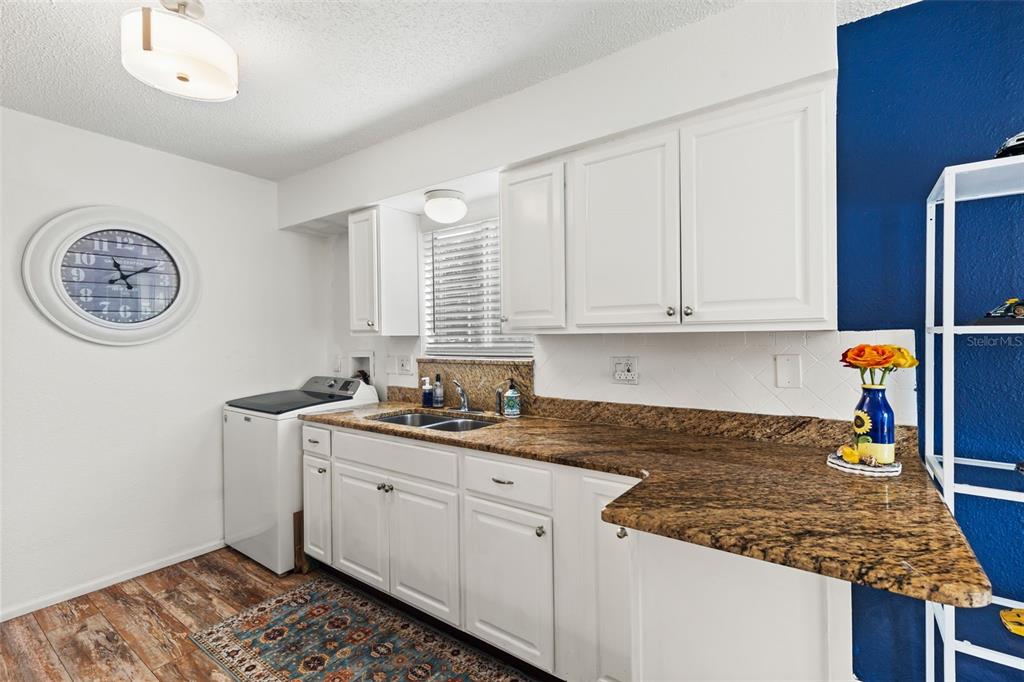 3802 Cortez Circle, Unit C Tampa, FL 33614 - Photo 11 of 24 a kitchen with stainless steel appliances granite countertop a sink stove and cabinets