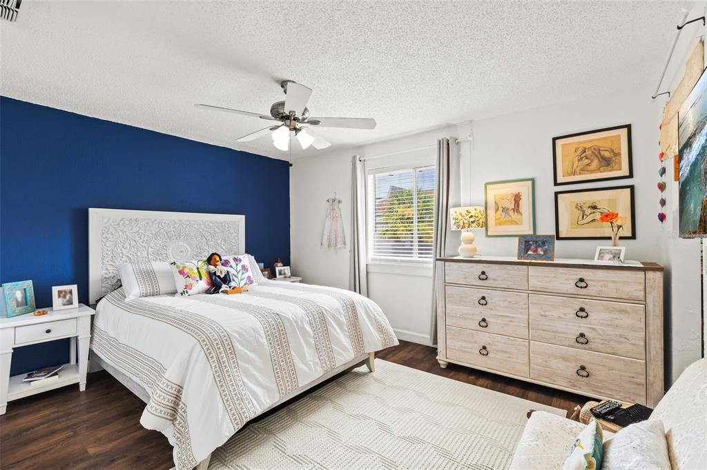 3802 Cortez Circle, Unit C Tampa, FL 33614 - Photo 15 of 24 a bedroom with a bed and a dresser