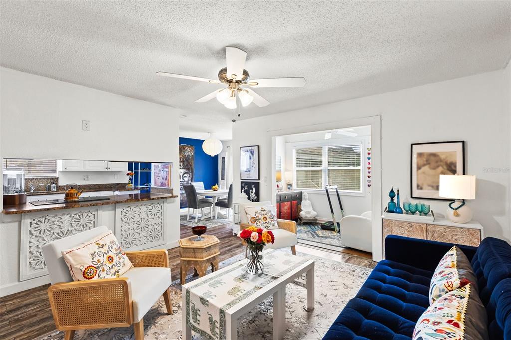 3802 Cortez Circle, Unit C Tampa, FL 33614 - Photo 2 of 24 a living room with furniture and a chandelier