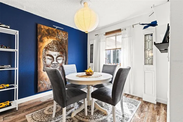 a dining room with furniture and window