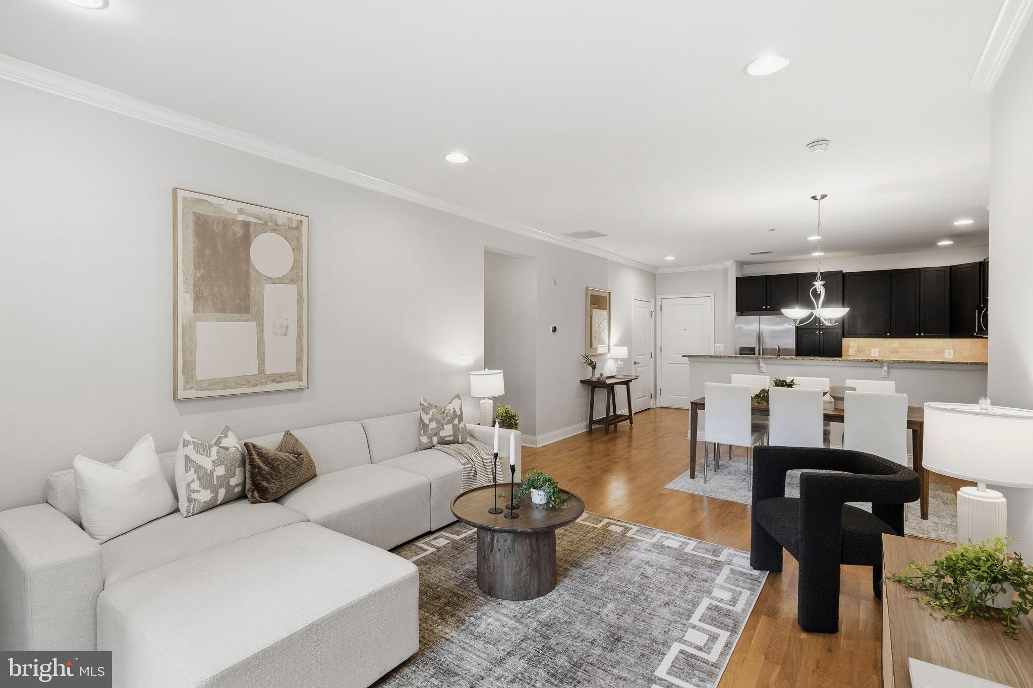 600 Commodore Court, Unit 2604 Philadelphia, PA 19146 - Photo 11 of 33 a living room with furniture and view of kitchen