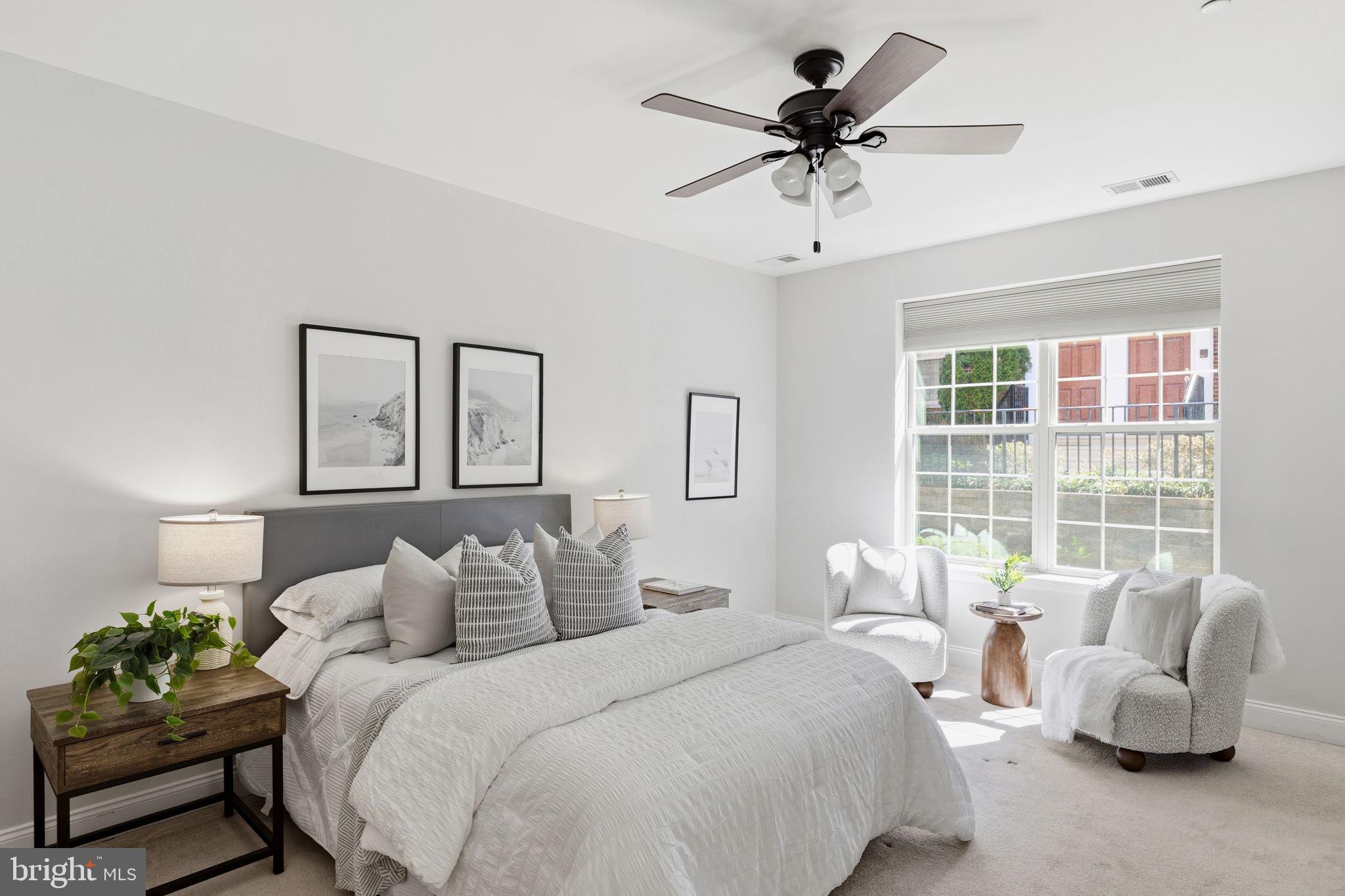 600 Commodore Court, Unit 2604 Philadelphia, PA 19146 - Photo 13 of 33 a spacious bedroom with a bed and a couch