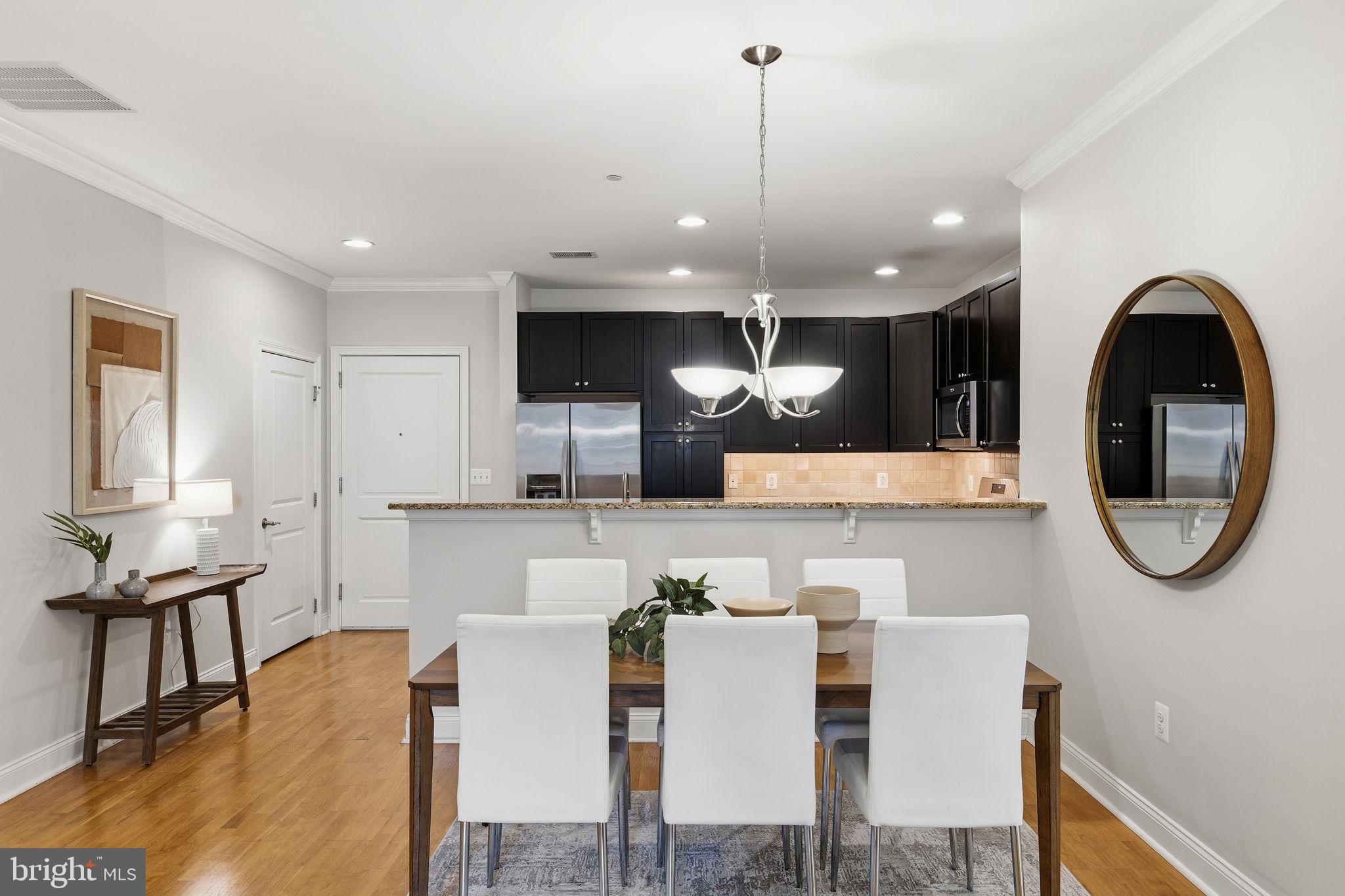 600 Commodore Court, Unit 2604 Philadelphia, PA 19146 - Photo 5 of 33 a large kitchen with a table and chairs