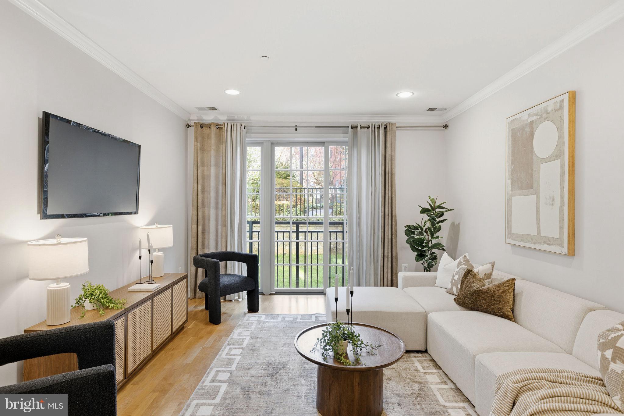600 Commodore Court, Unit 2604 Philadelphia, PA 19146 - Photo 8 of 33 a living room with furniture and a flat screen tv