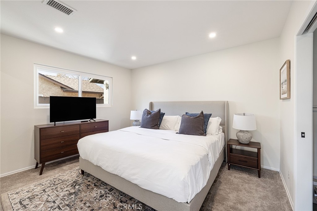 2206 Stinson Street Simi Valley, CA 93065 - Photo 13 of 22 a bedroom with a bed and a flat screen tv