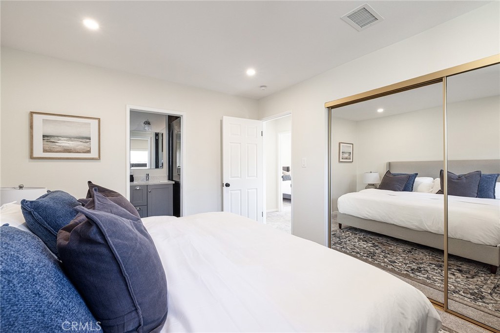 2206 Stinson Street Simi Valley, CA 93065 - Photo 14 of 22 a spacious bedroom with a bed and a couch